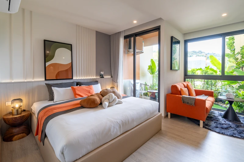 Saint Tropez Naithon — studio A show unit: bed and armchair by the window