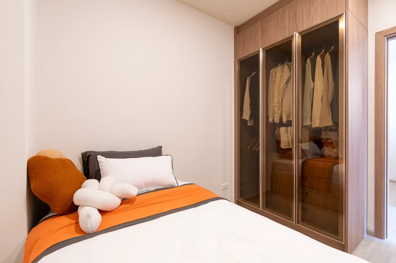 Saint Tropez Naithon — two-bedroom B1 show unit: second bedroom and glass-door wardrobe