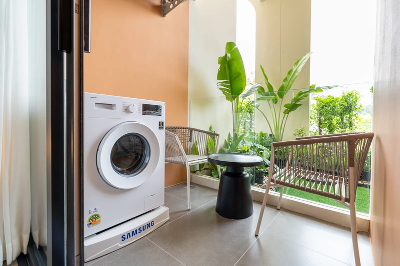 Saint Tropez Naithon — two-bedroom B1 show unit: terrace with washing machine and planting