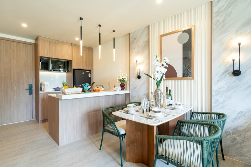 Saint Tropez Naithon — two-bedroom B1 show unit: kitchen island and dining table